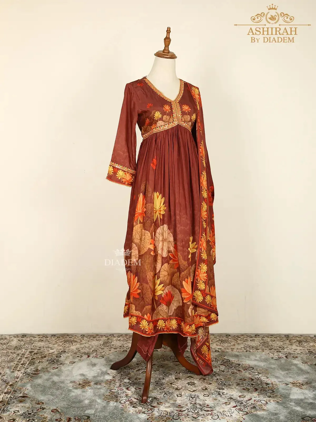 Brown Straight Cut Suits Adorned with Floral Embroidery and Prints along with Dupatta