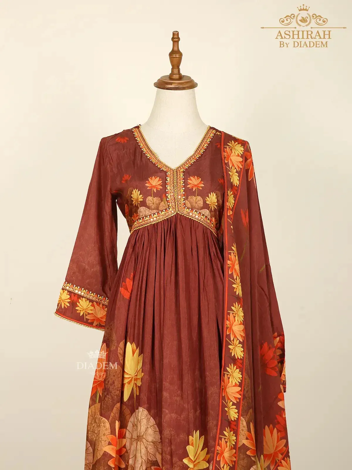 Brown Straight Cut Suits Adorned with Floral Embroidery and Prints along with Dupatta