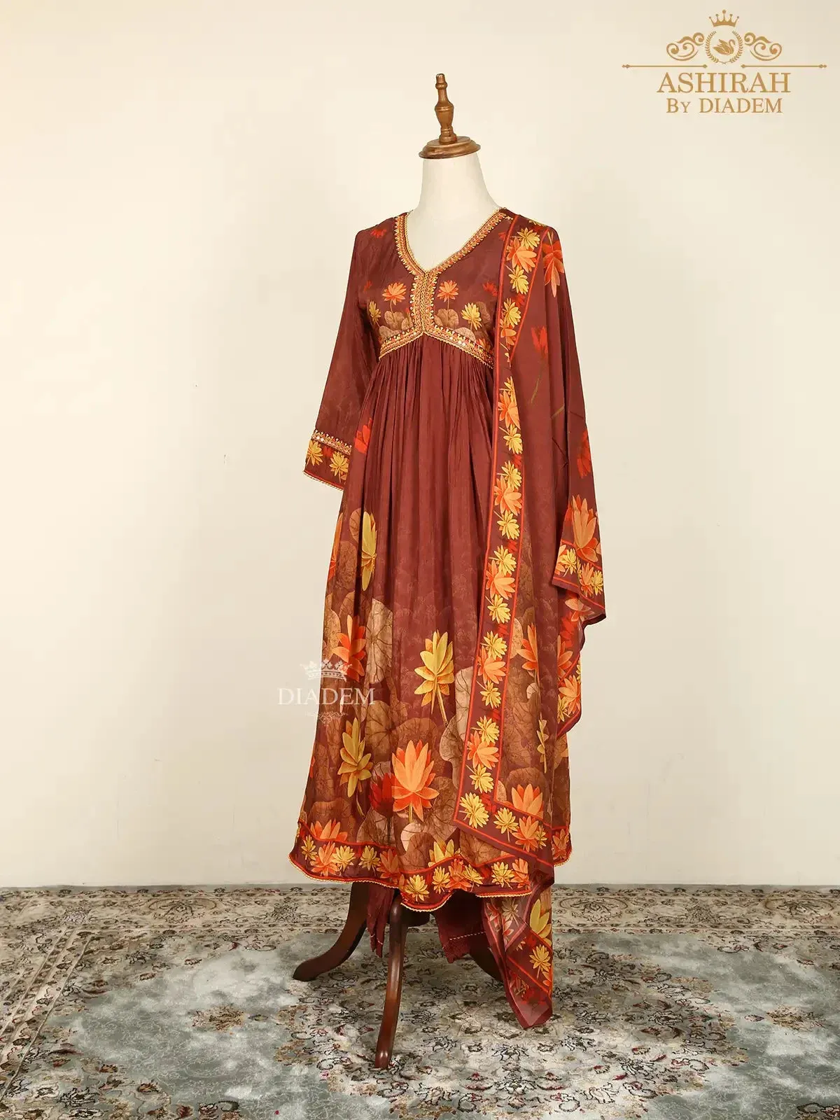 Brown Straight Cut Suits Adorned with Floral Embroidery and Prints along with Dupatta