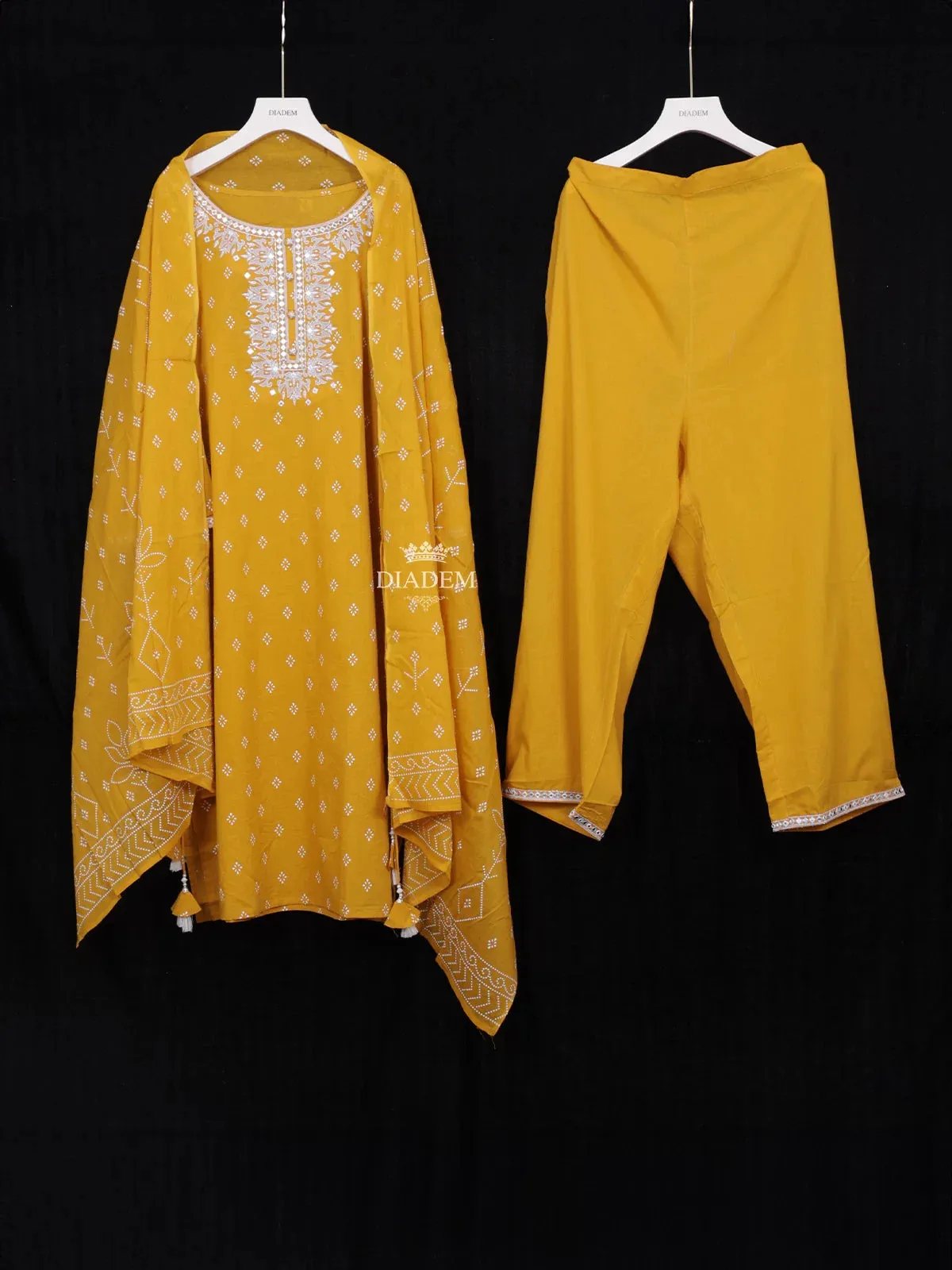 Chrome Yellow Cotton Straight Cut Salwar Suit Adorned with Floral Prints and Mirrorwork Paired with Dupatta