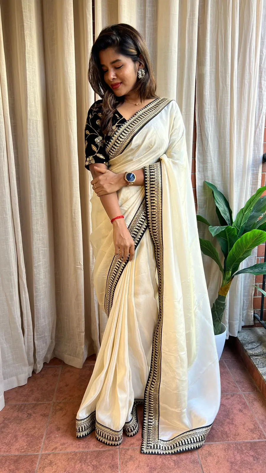 Golden silk saree with black hand work blouse