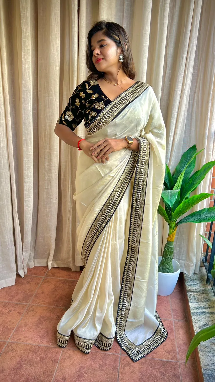 Golden silk saree with black hand work blouse