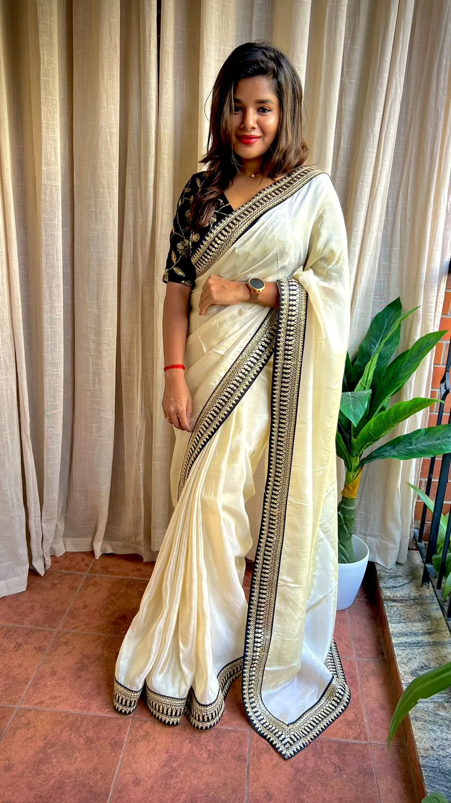 Golden silk saree with black hand work blouse