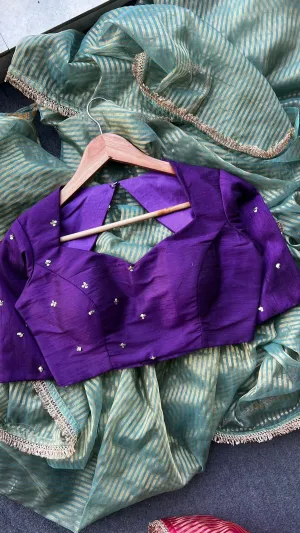 Pista green stripped tissue saree with purple hand worked blouse