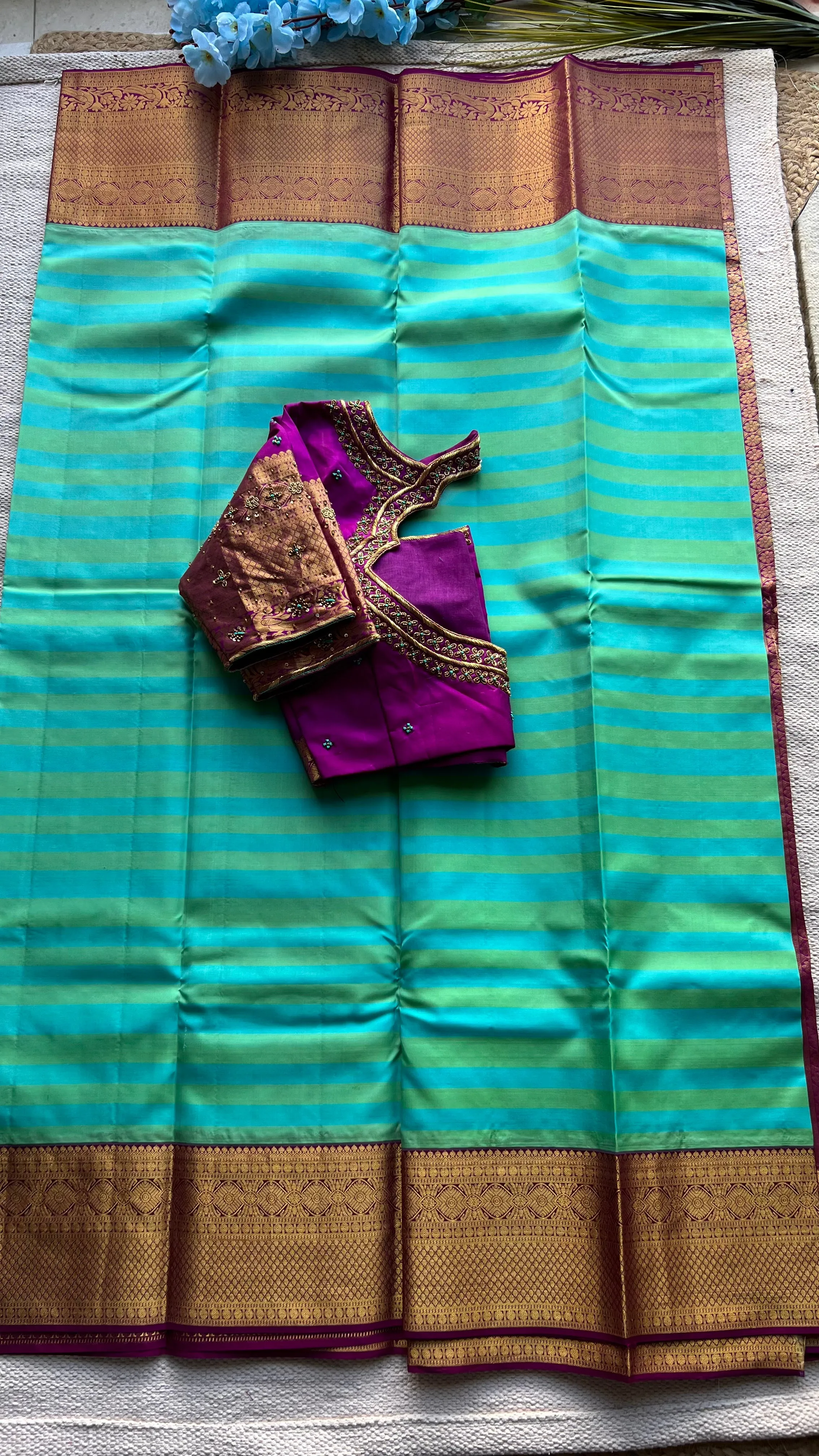 Sea blue and purple kanchipuram silk saree with hand worked blouse