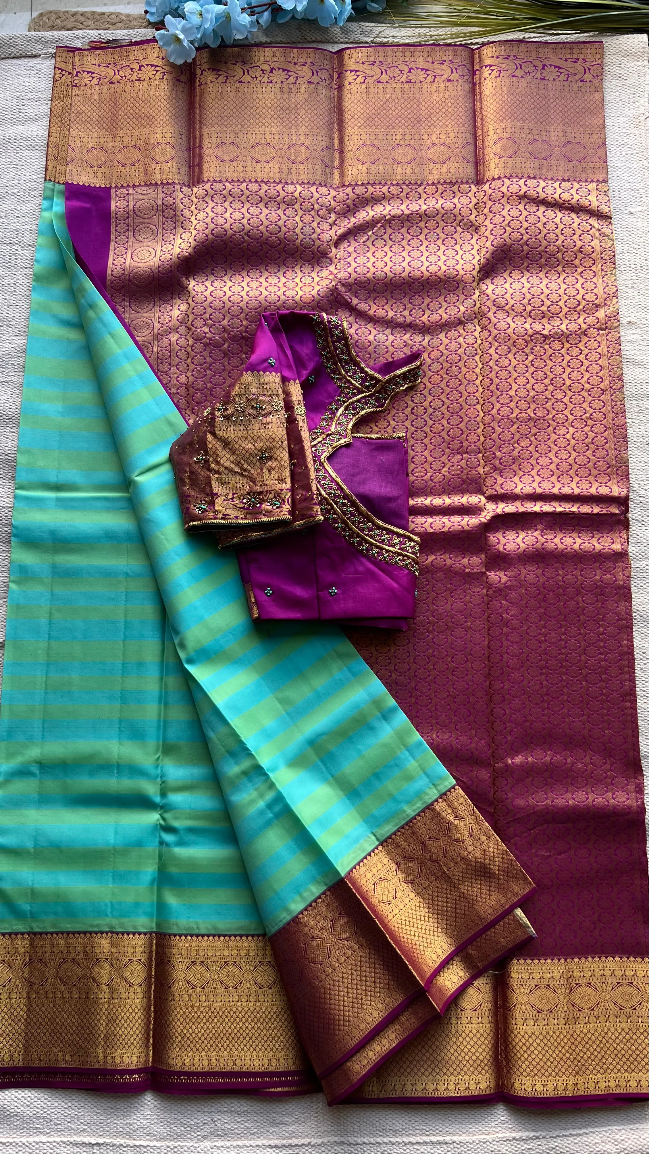 Sea blue and purple kanchipuram silk saree with hand worked blouse