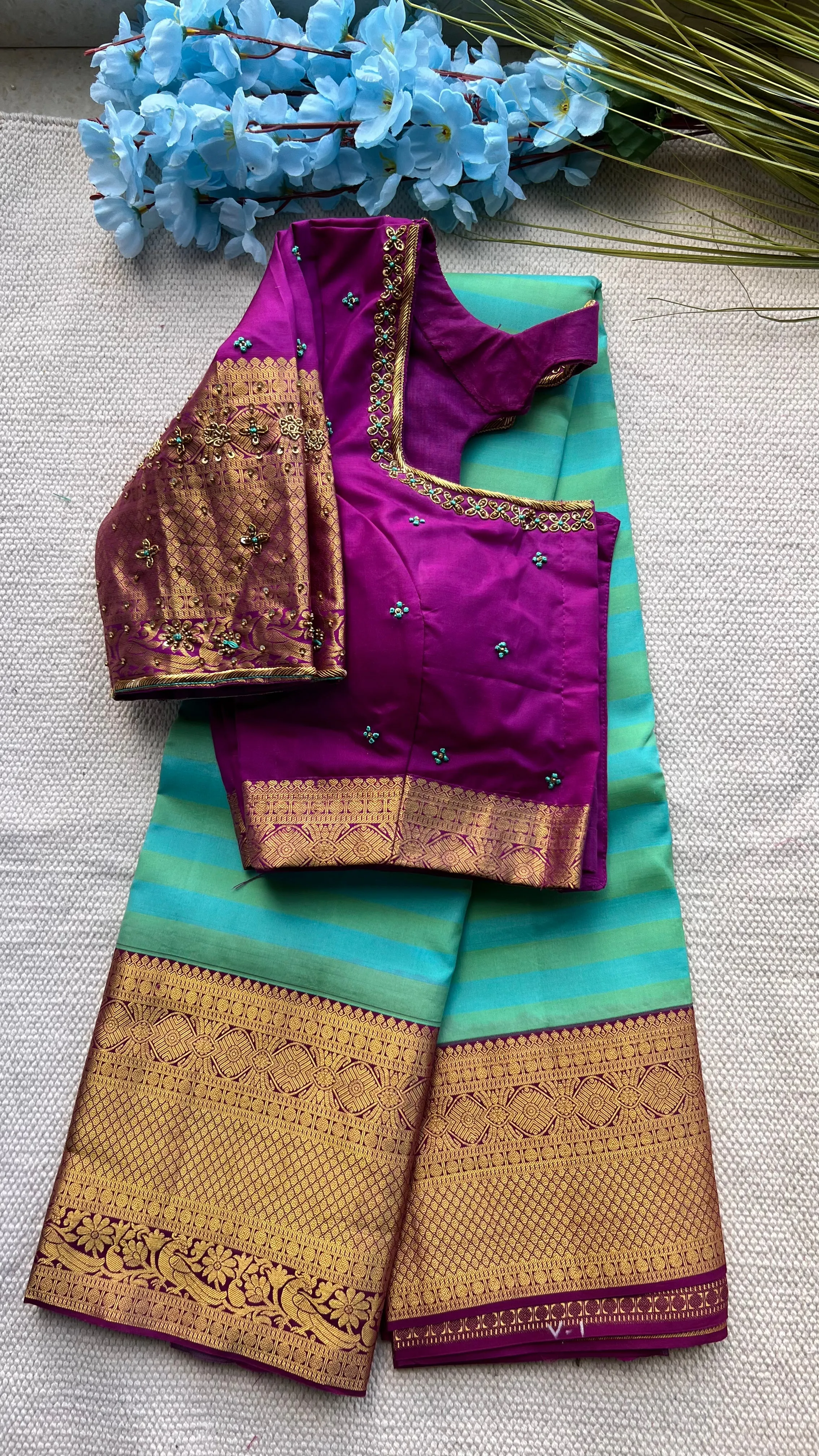 Sea blue and purple kanchipuram silk saree with hand worked blouse